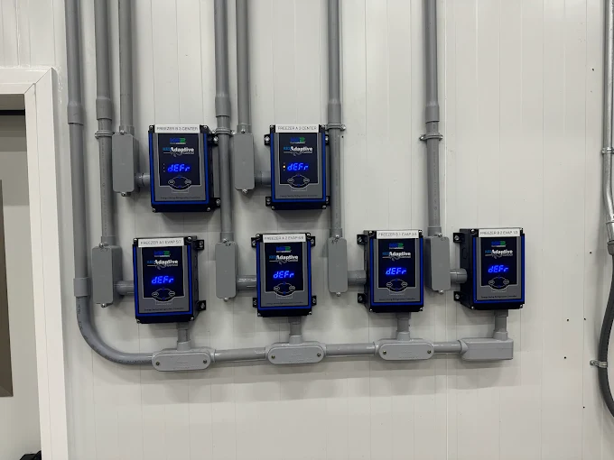 Adaptive defrost control panel for freezers